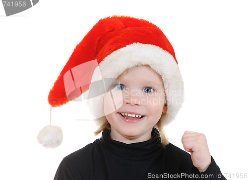 Image of The child in a hat santa claus