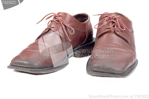 Image of used brown mans shoes