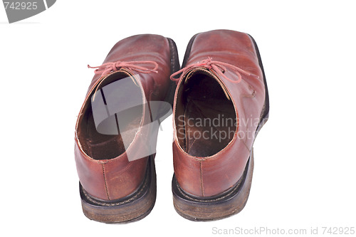 Image of used brown mans shoes