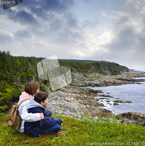 Image of Children sitting at Atlantic coast in Newfoundland