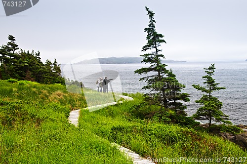 Image of Father and children at Atlantic coast in Newfoundland