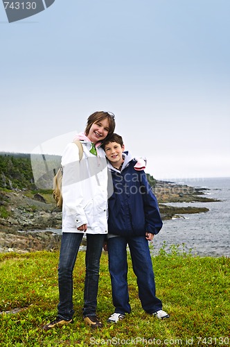 Image of Children standing at Atlantic coast in Newfoundland