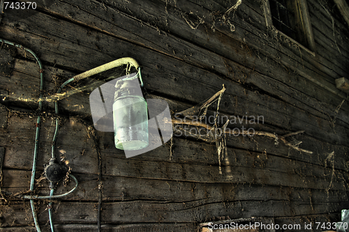 Image of Old lamp in rural barn