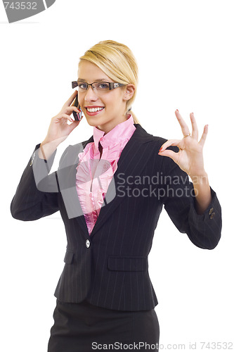 Image of  businesswoman on the phone winning