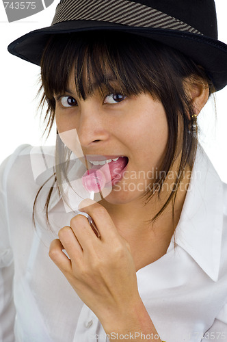 Image of beautiful woman with lollipop