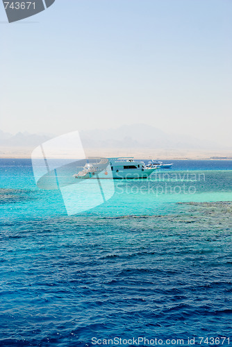 Image of Yacht in sea with coral reefs