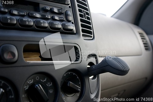 Image of Dashboard, radio and the plug in ionizer