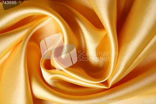Image of Smooth elegant golden satin as background 