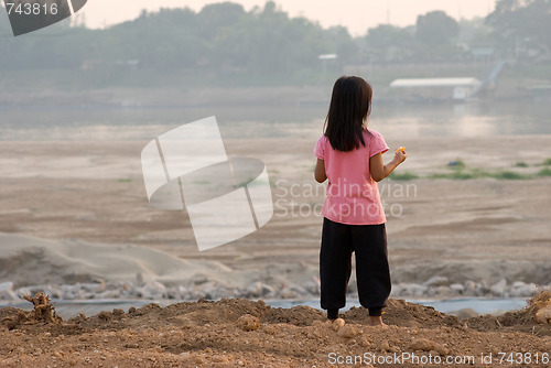 Image of Laotian girl watching Mekong river