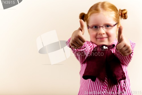 Image of Portrait of cute elegant redhead girl showing thumbs up