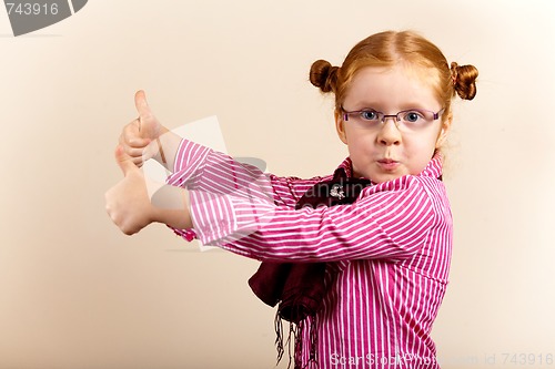 Image of Portrait of cute elegant redhead girl showing thumbs up