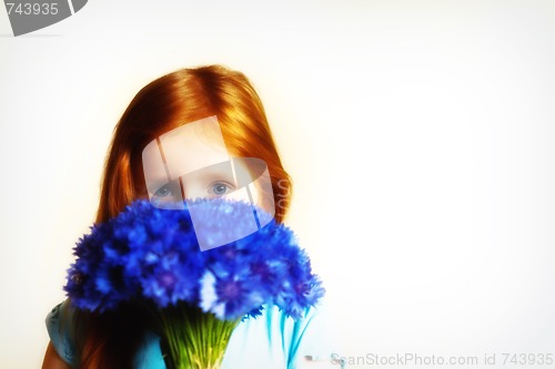 Image of Portrait of redhead girl with cornflowers