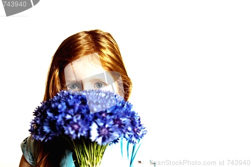 Image of Portrait of redhead girl with cornflowers