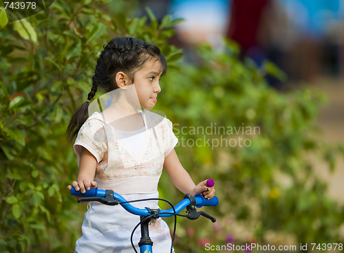 Image of cute girl on her bike