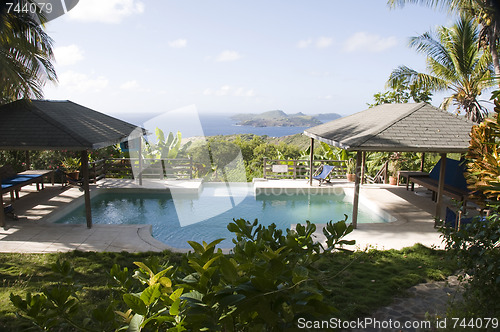 Image of caribbean island villa pool with lovely view of grenadine island