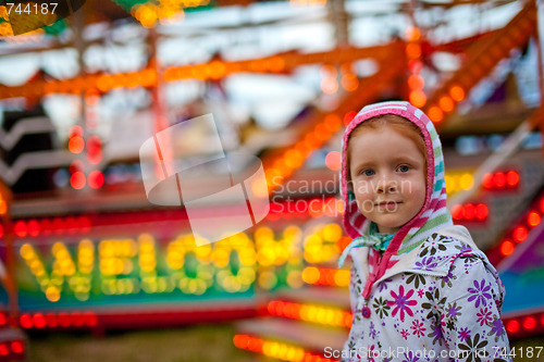 Image of Little girl in amusement park