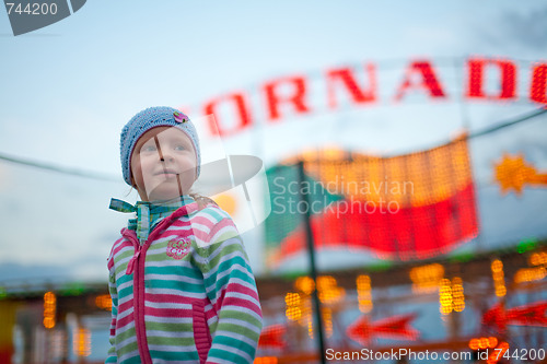 Image of Little girl in amusement park