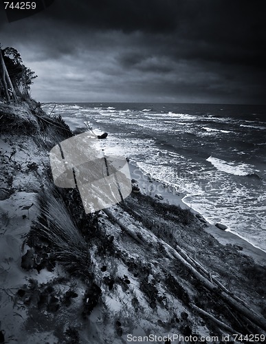 Image of Baltic coast with eroded beach and landslide after storm dramatic sky b/w