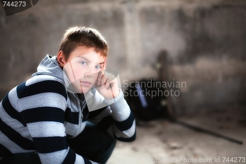 Image of Handsome teenaiger looking self assured at camera portrait added glow