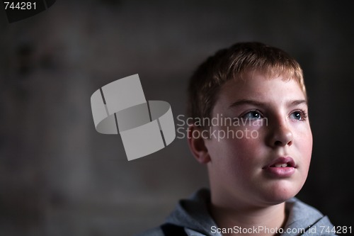Image of Young boy looking up with hope in his eyes  copy space
