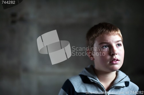 Image of Young boy looking up with hope in his eyes