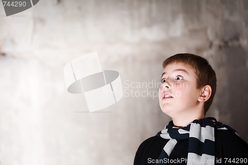 Image of Young boy looking up with hope in his eyes  copy space