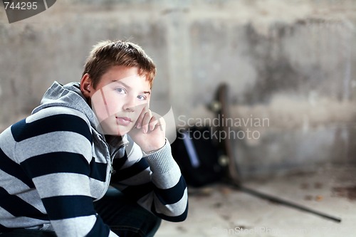 Image of Handsome teenaiger looking self assured at camera portrait