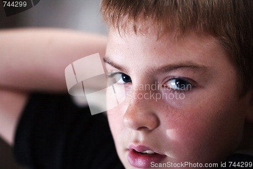 Image of Young boy looking up with hope in his eyes