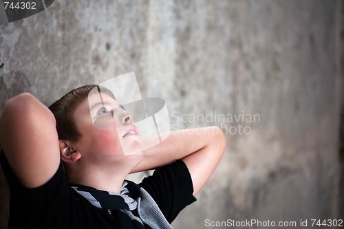 Image of Young boy looking up with hope in his eyes