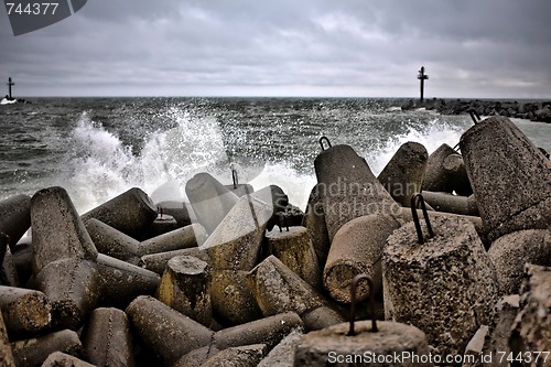 Image of breakwater during autumn stormy day