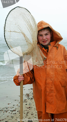 Image of Boy with fisherman's coat