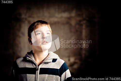 Image of Young boy looking up with hope in his eyes High contrast