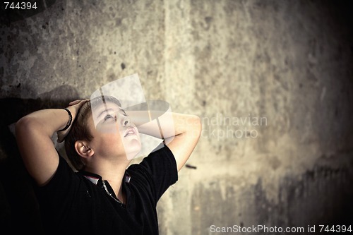Image of Young boy looking up with hope in his eyes high contrast 