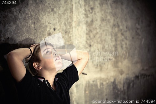 Image of Young boy looking up with hope in his eyes high contrast 