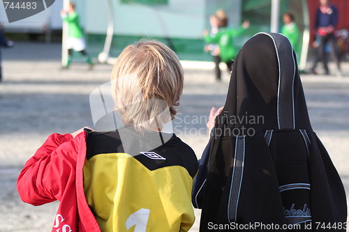 Image of Boys watcing a football match