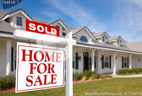 Image of Sold Home For Sale Sign and New Home