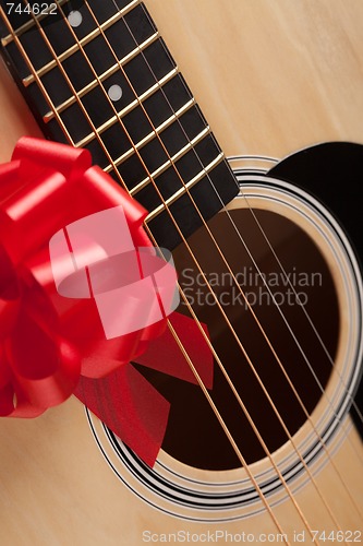 Image of Guitar Strings with Red Ribbon