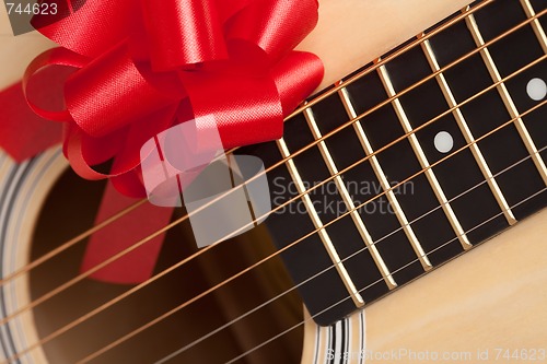 Image of Guitar Strings with Red Ribbon