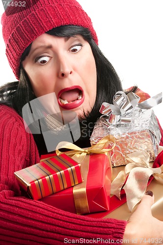 Image of Excited Woman Balancing Holiday Gifts
