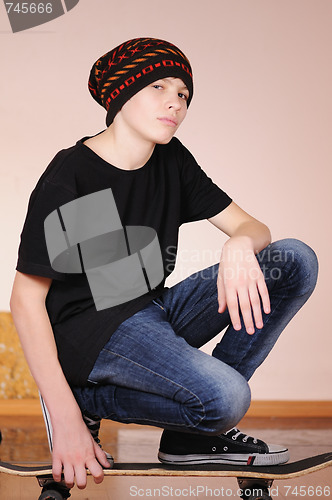 Image of The teenager with a skateboard 