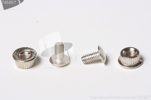 Image of Many screws and nuts isolated on white background