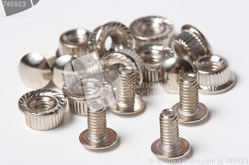 Image of Many screws and nuts isolated on white background