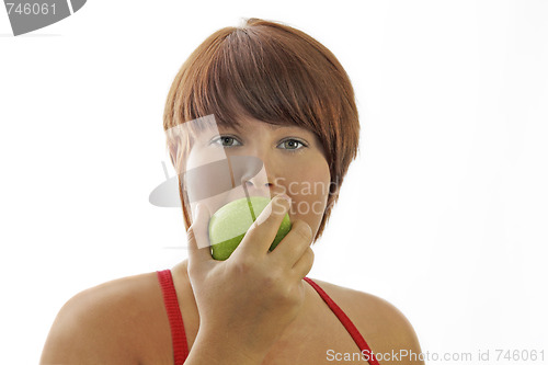 Image of Young woman with apple
