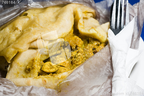 Image of dahl pouri roti  trinidad native food wrap also called bust up s