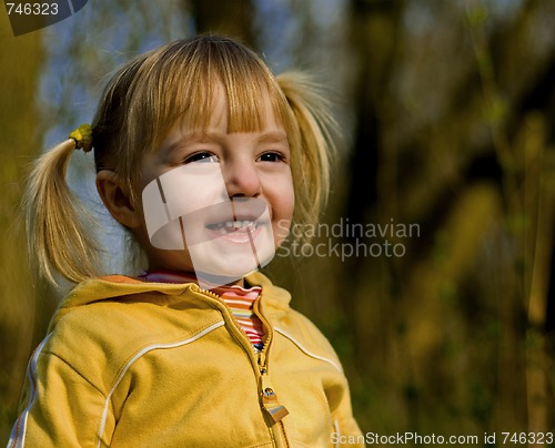 Image of Little girl looks at a sunset