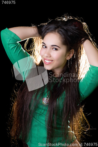 Image of Portrait of the smiling girl. Isolated on black