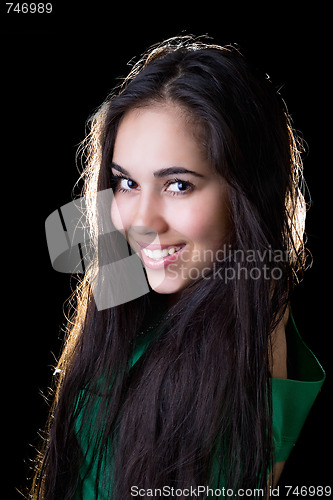 Image of Portrait of the smiling girl in a green jacket