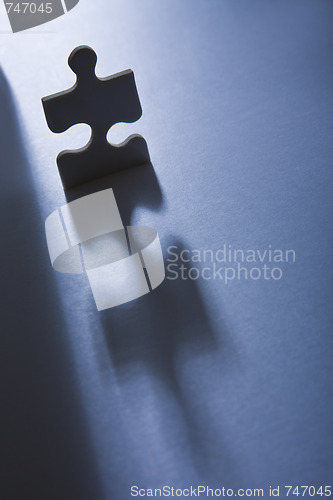 Image of Jigsaw Piece with Dramatic Light