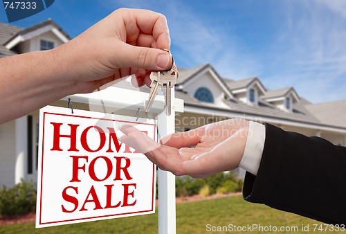 Image of Handing Over the House Keys in Front of New Home