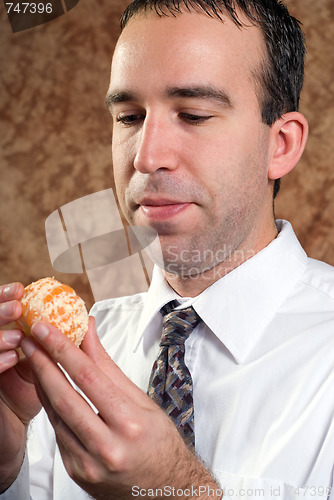 Image of Businessman Holding Orange